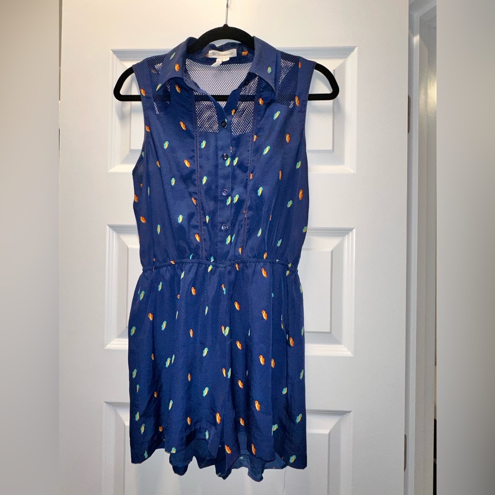 BCBGeneration romper with vibrant pattern and fishnet design NWOT